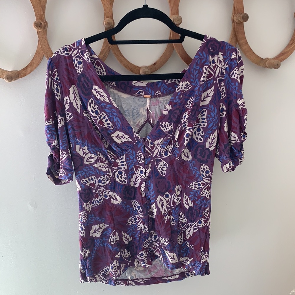 V- neck, button down short sleeve shirt